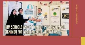 the photo shows three people standing, from the right there's a man wearing white t-shirt, then a man wearing black t-shirt and a beanie, then at last a woman wearing all black islamic dress. it was a picture between IIUM Schools and PT Dimulti Pilar Narmadi representatives